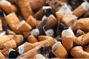 Pile of cigarette butts enticing the readers to quit smoking.